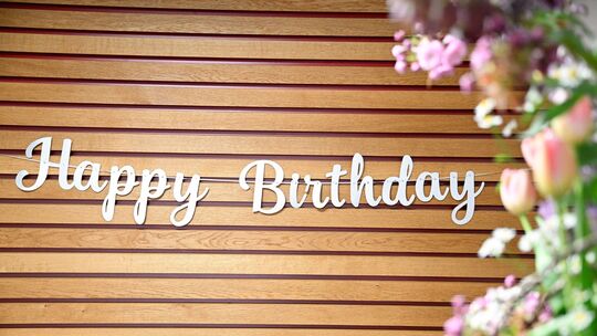 The image says "Happy birthday" and it a symbol of celebrating MES's 20th anniversary.